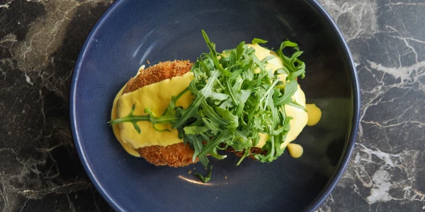 salmon_fishcakes_topped_with_rocket_in_a_hollandaise_sauce.jpg